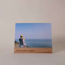 Load image into Gallery viewer, A Wooden photo holder with Our Happy Place engraving. A Perfect Gift. Made in St Ives Cornwall.
